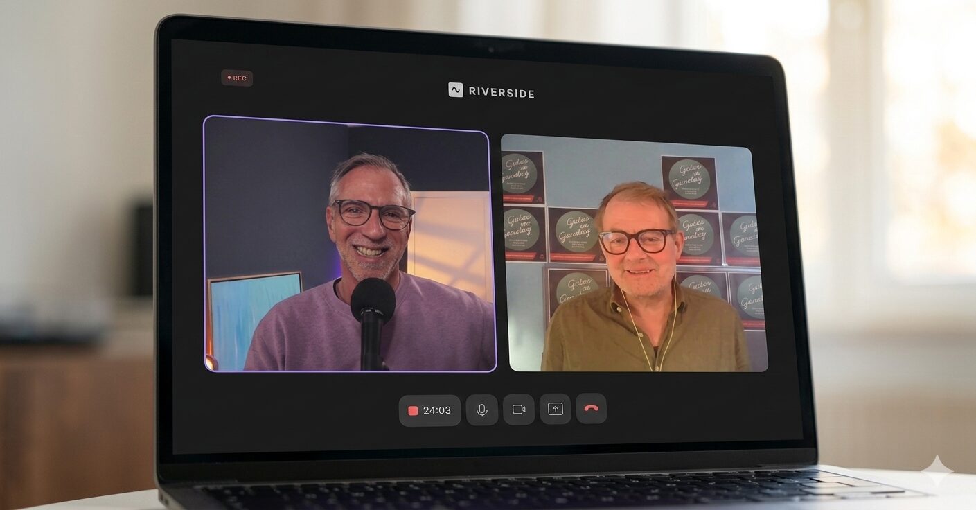 Markus Tirok sitzt an Schreibtisch mit einem Stapel Bücher